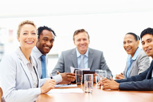 Businesspeople working on laptop